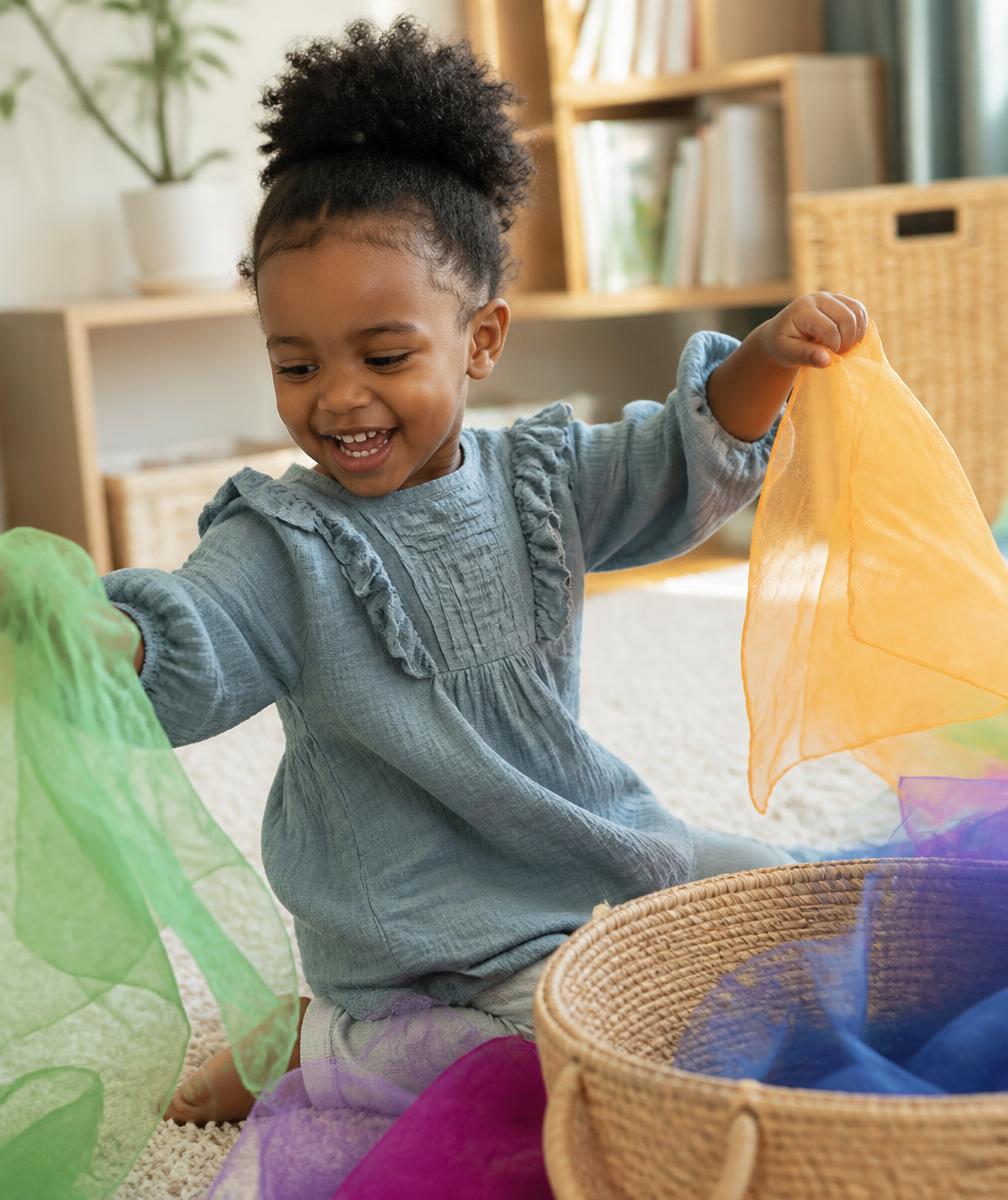 Toddler playing creatively with colorful props